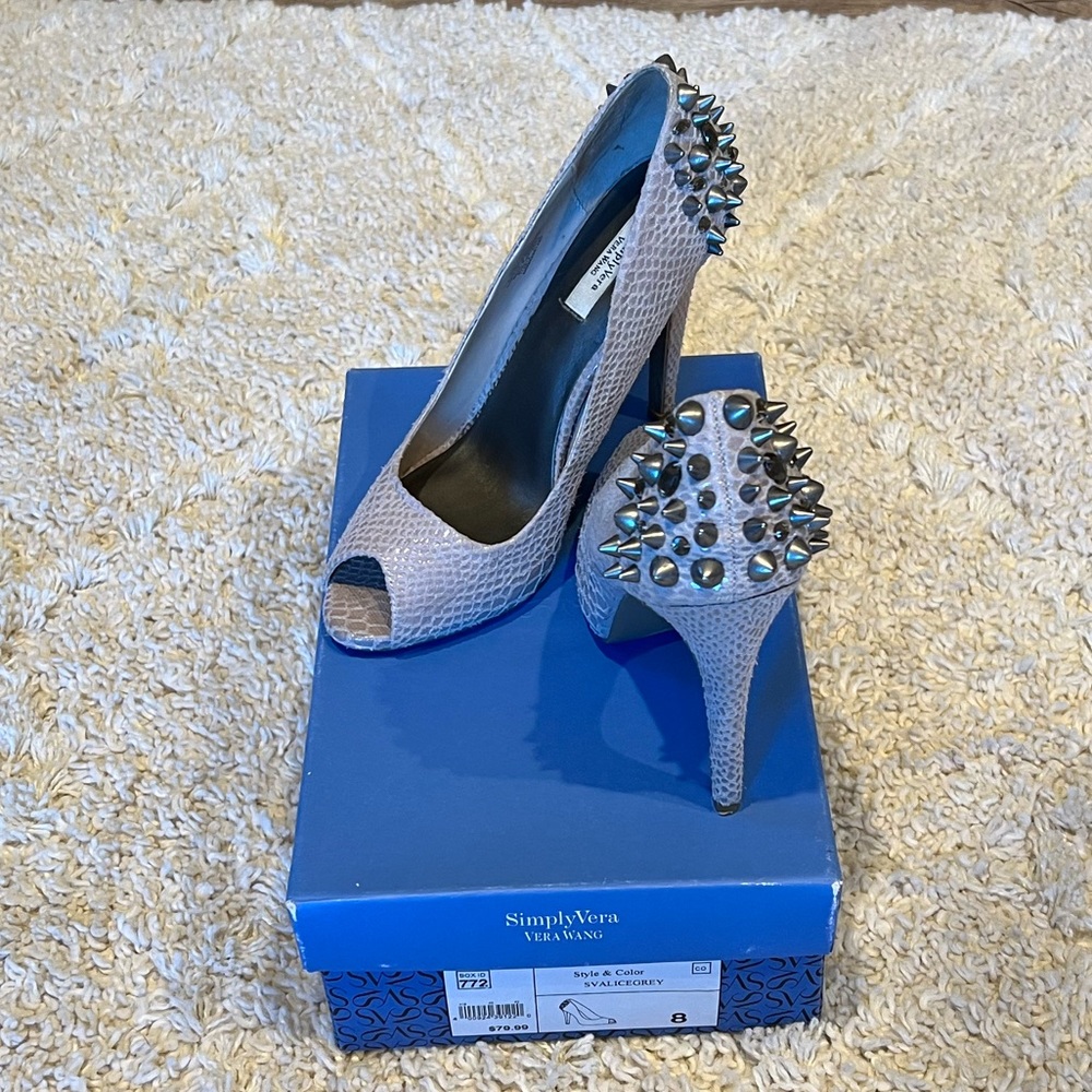 Size 8 Vera Wang heels. With stud, spike and gemstone detailing.